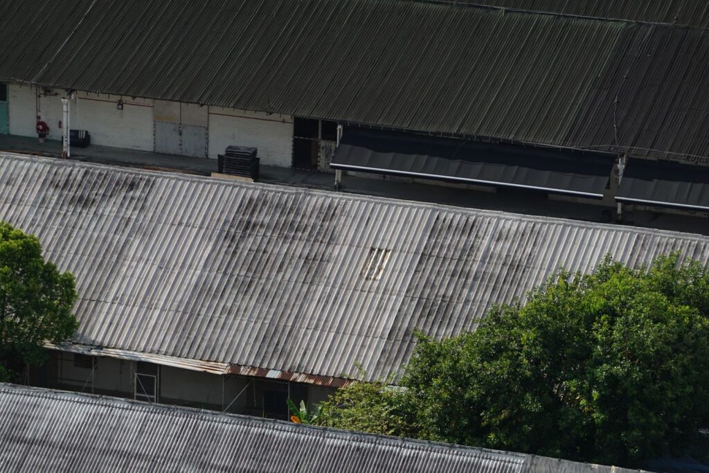 Corrugated metal roofs on rural buildings near Crescent, OK