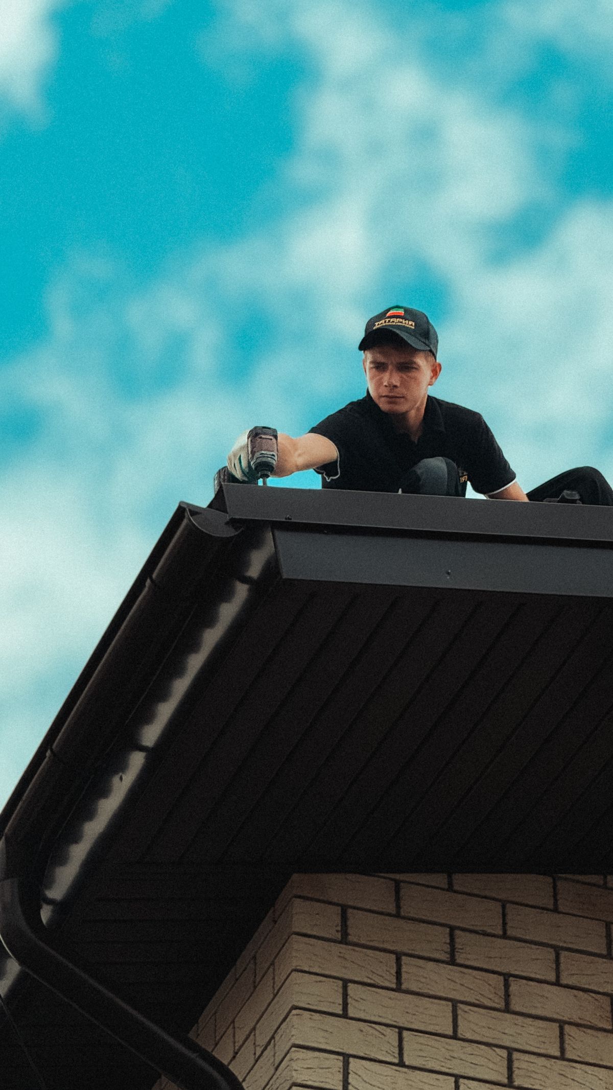 Roofer working on a house roof in Crescent, OK